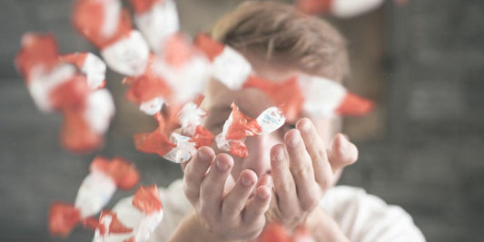 man scattering flower petals